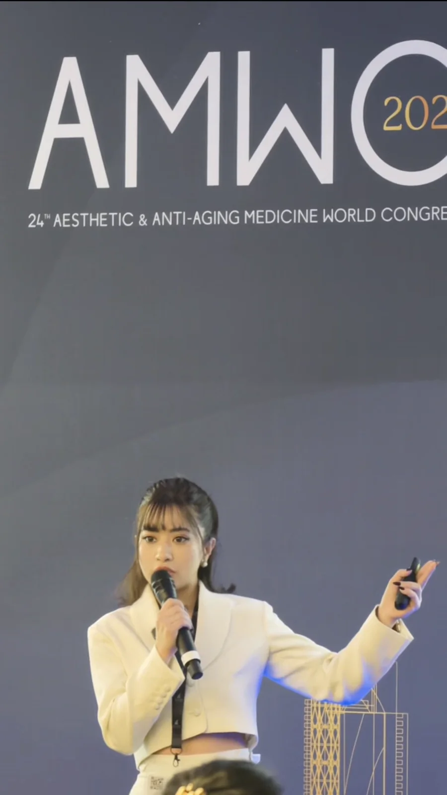 Dr. Garima speaking on the AMWC Monaco stage in March 2026